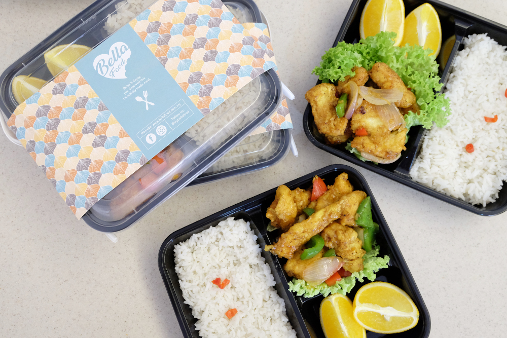 Each pack comes with the main dish, rice and fruits. — Picture by Steven Ooi KE