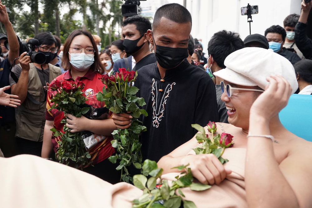 Pro-democracy leaders Panusaya 'Rung' Sithijirawattanakul, Panupong 'Mike' Jadnok, Chaiamorn Kaewwiboonpan (R), and other activists  at the Attorney General's office in Bangkok, Thailand February 17, 2021. u00e2u20acu201d Reuters pic