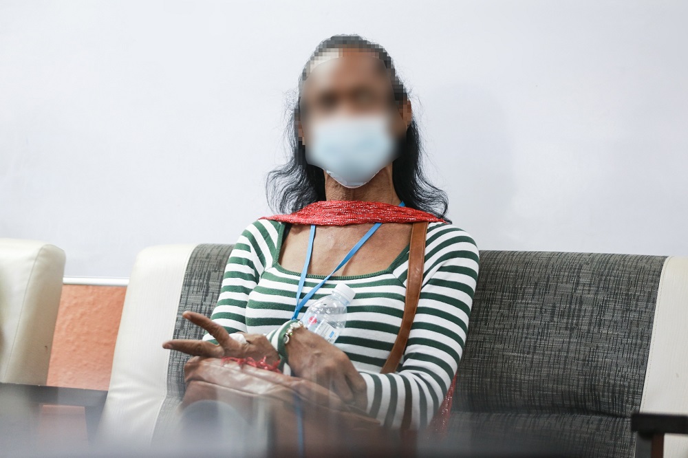 Mala experienced verbal and physical abuse many times on the street.  —  Picture by Ahmad Zamzahuri