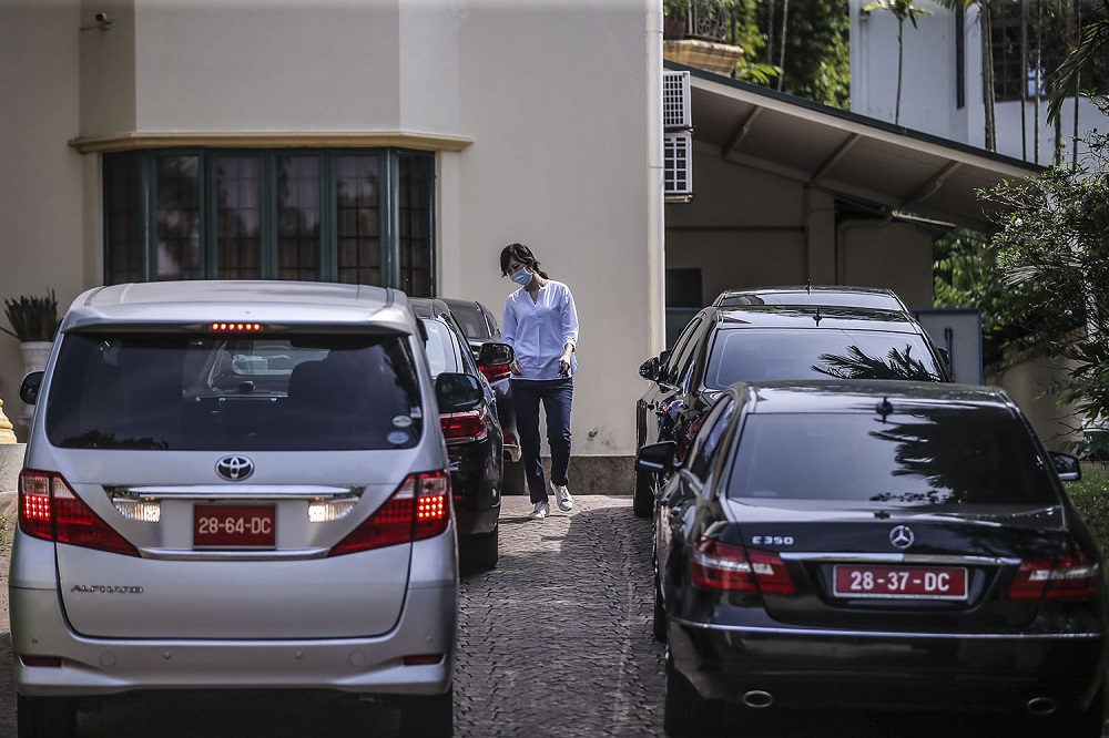 A woman, believed to be a staff member,  is seen outside the North Korean Embassy in Kuala Lumpur March 20, 2021. 