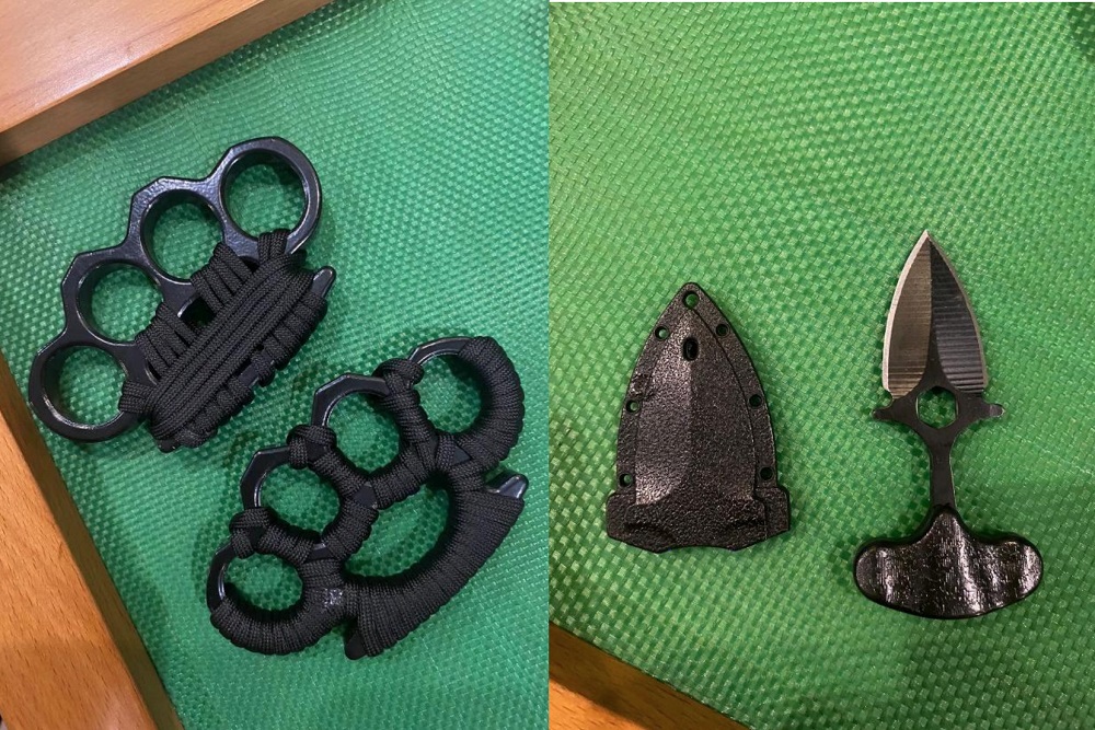Two knuckledusters and a push dagger were seized from the residence. — Picture courtesy of Singapore Police Force via TODAY
