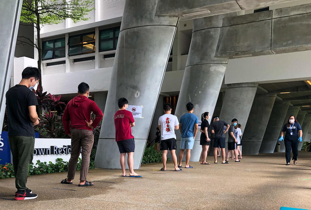 NUS UTown residents queueing up to be swabbed for Covid-19 on March 23, 2021 after traces of the virus were found in wastewater there. u00e2u20acu201d TODAY pic