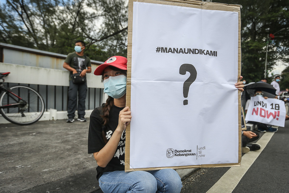 Protesters hold placards in front of Parliament building to protest the Election Commission's (EC) delay in allowing 18-years old to vote in Kuala Lumpur March 27, 2021. u00e2u20acu201dPicture by Yusof Mat Isa