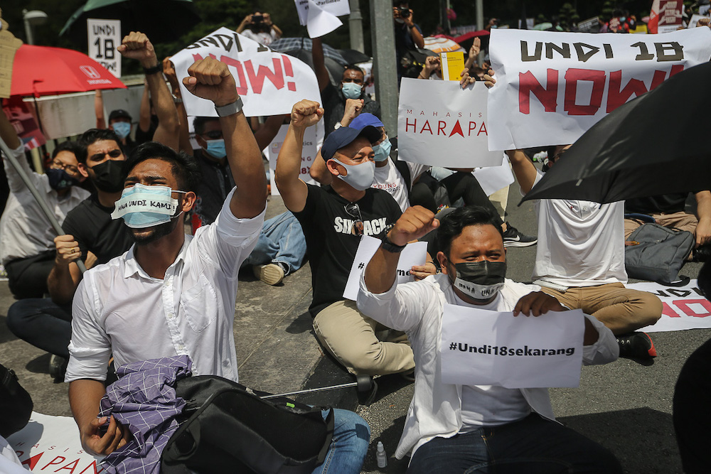 Former Education Minister Maszlee Malik (centre) at a protest over the Election Commission's (EC) delay in allowing 18-years old to vote in Kuala Lumpur March 27, 2021. u00e2u20acu201d Picture by Yusof Mat Isan