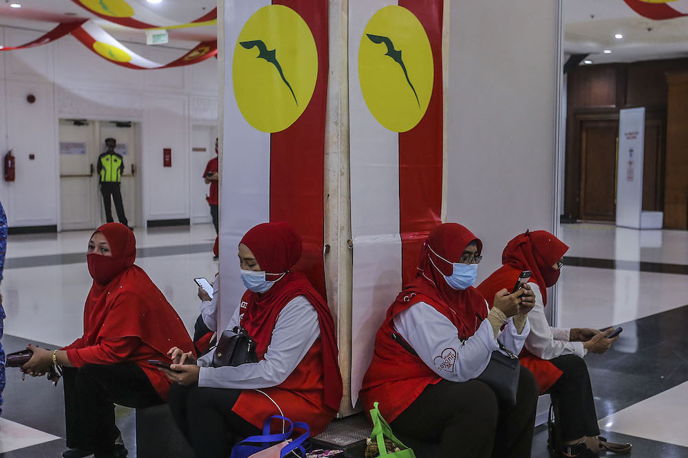 Umno members arrive for the party's 2020 general assembly in Kuala Lumpur March 28, 2021. u00e2u20acu2022 Picture by Hari Anggara.nnn