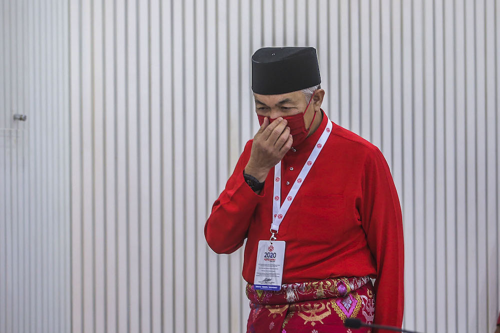 Umno president Datuk Seri Ahmad Zahid Hamidi (centre) speak to reporters during the press conference at the 2020 Umno annual general meeting in Kuala Lumpur March 28, 2021. u00e2u20acu2022 Picture by Hari Anggarann