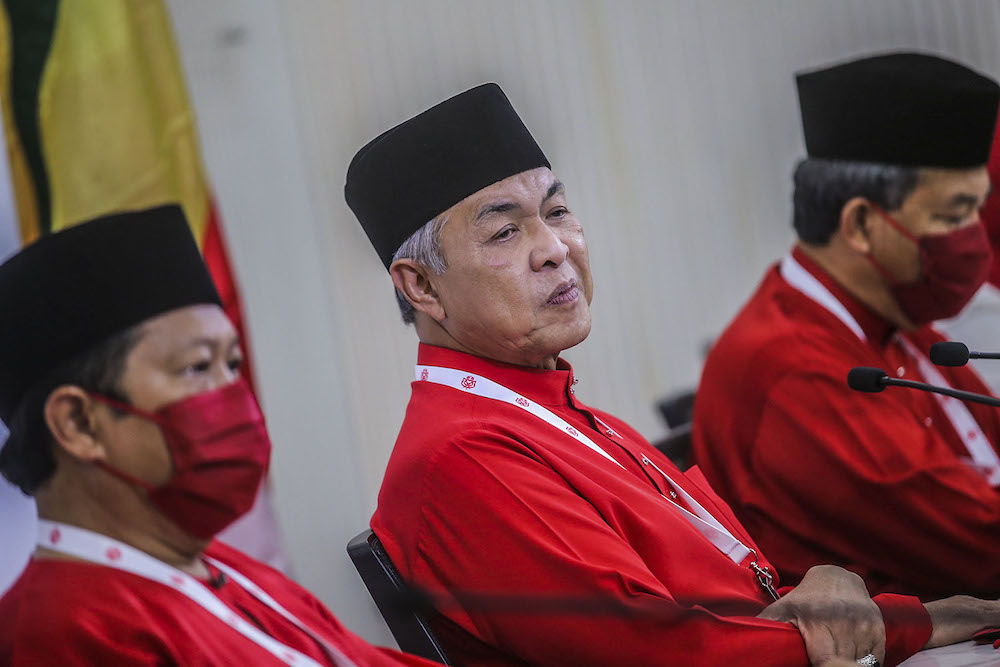 Umno president Datuk Seri Ahmad Zahid Hamidi (centre) speak to reporters during the press conference at the 2020 Umno annual general meeting in Kuala Lumpur March 28, 2021. u00e2u20acu2022 Picture by Hari Anggarann