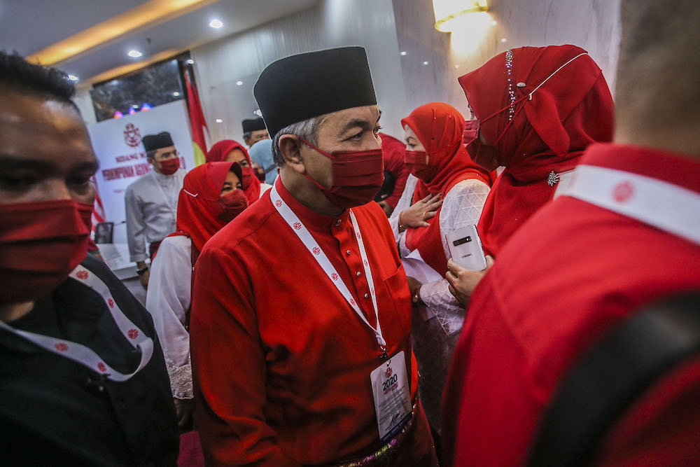 Umno president Datuk Seri Ahmad Zahid Hamidi (centre) speak to reporters during the press conference at the 2020 Umno annual general meeting in Kuala Lumpur March 28, 2021. u00e2u20acu2022 Picture by Hari Anggarann