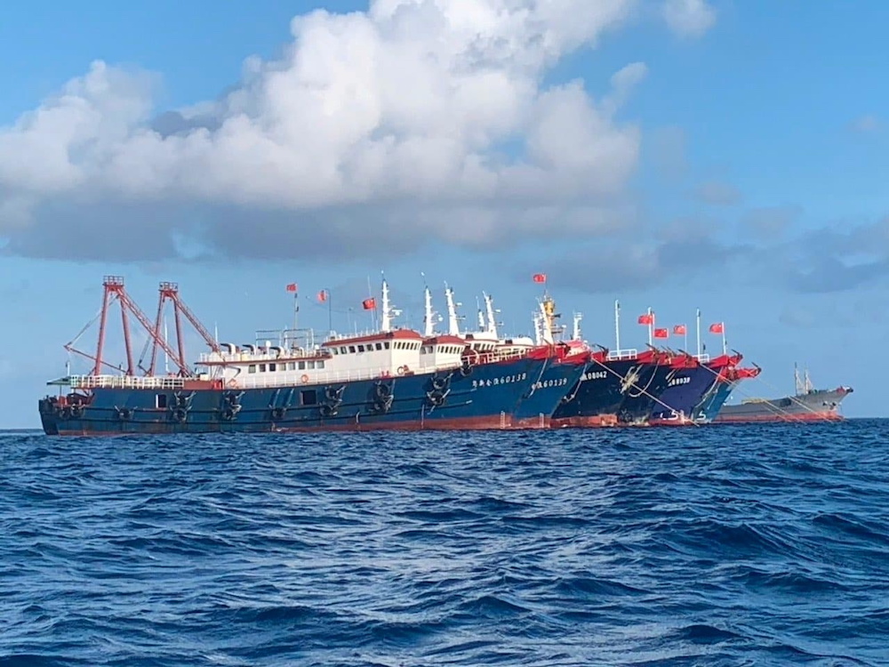 Chinese vessels, believed to be manned by Chinese maritime militia personnel, are seen at Whitsun Reef, South China Sea on March 27, 2021. Philippine Coast Guard/National Task Force-West Philippine Sea/Handout via Reuters