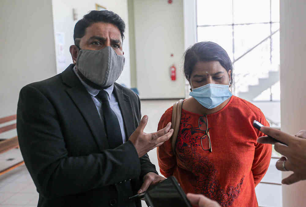 M. Indira Gandhi was accompanied by Indira Gandhi Action Team (Ingat) chairman Arun Dorasamy at the High Court in Ipoh March 22, 2021. u00e2u20acu201d Picture by Farhan Najib