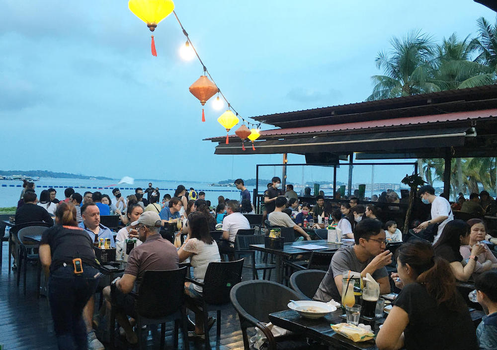 People having dinner at a restaurant in Pasir Ris Park, Singapore. u00e2u20acu201d TODAY pic