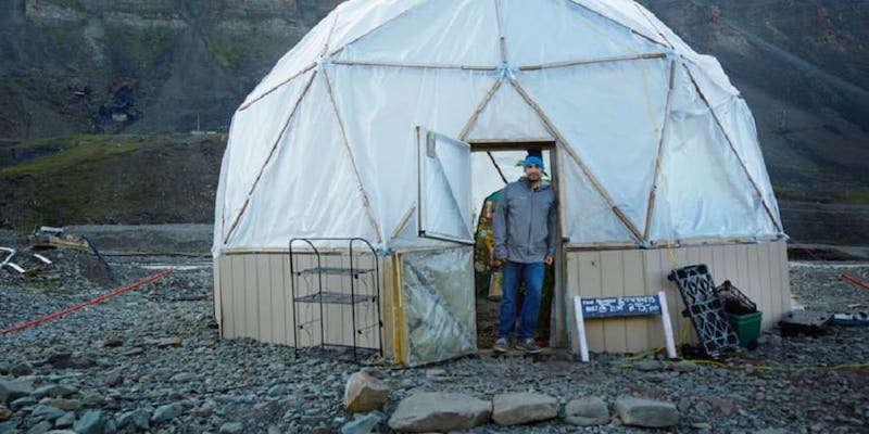 Chef Benjamin Vidmar in front of his geodesic greenhouse in Longyearbyen, Norway. u00e2u20acu201d Picture courtesy of Energy Observer Solutions