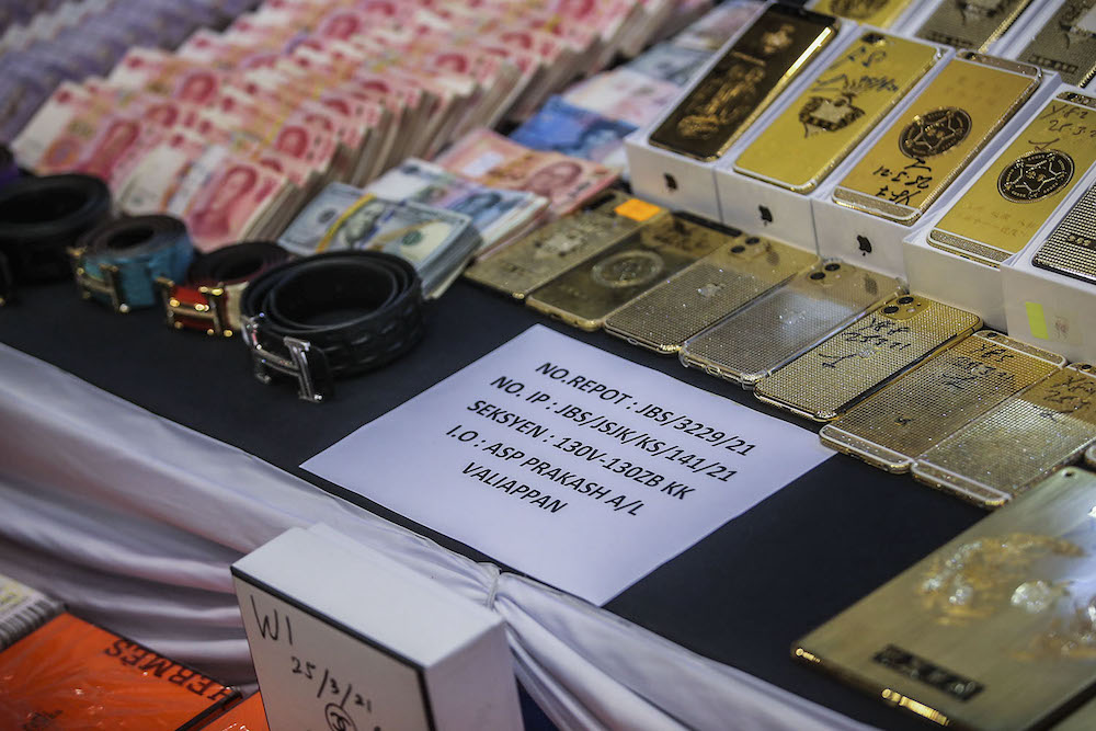 Some of the items seized by police are shown during a press conference at Bukit Aman March 30, 2021. ― Picture by Hari Anggara
