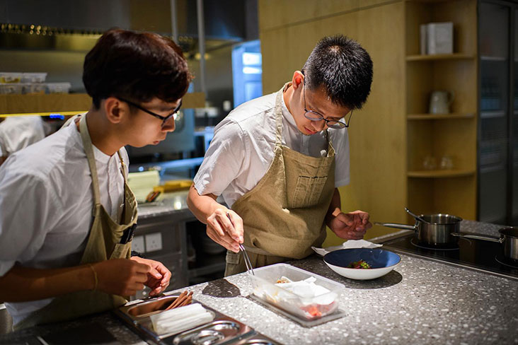 Johnson Wong from Gēn 根 working on a dish during dinner service – Picture courtesy of Gēn 根's Facebook
