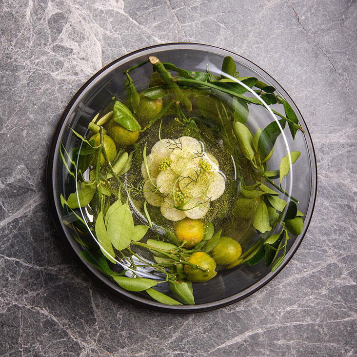 Layered yam bean or jicama is used to create a crisp, refreshing dish together with 'belimbing' and kaffir lime at Gēn 根 – Picture courtesy of Gēn 根's Facebook