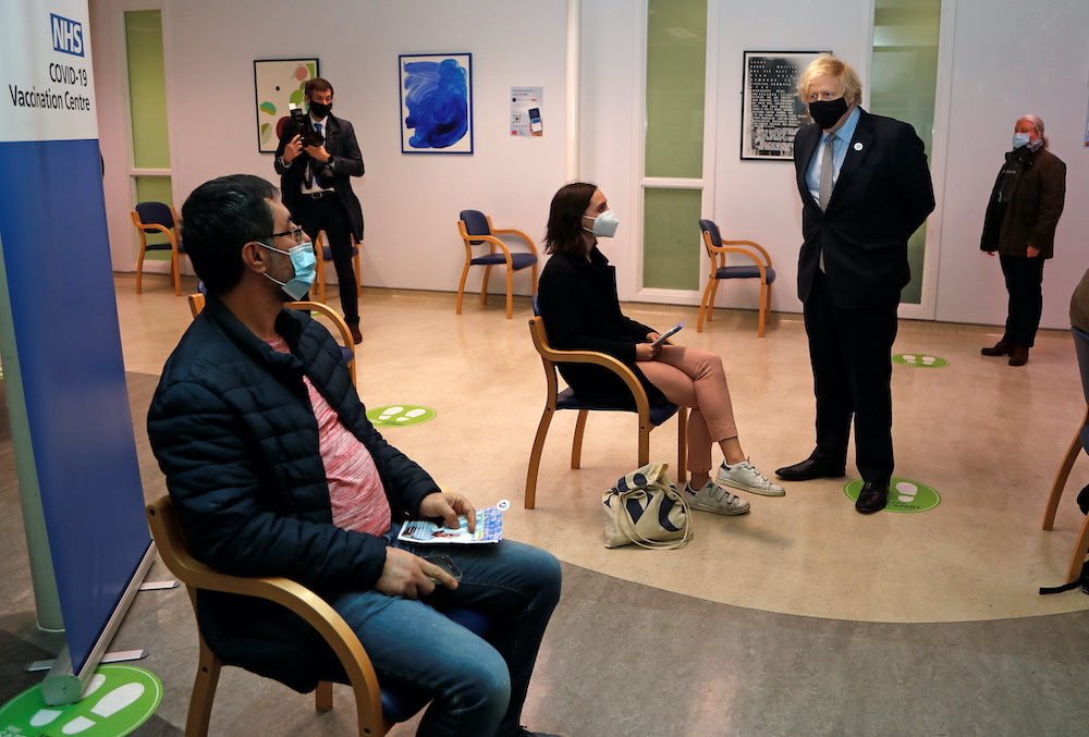 Britainu00e2u20acu2122s Prime Minister Boris Johnson speaks to members of the public who had just been vaccinated after receiving a dose of the Oxford/AstraZeneca Covid-19 vaccine, amid the coronavirus disease pandemic, in London, Britain March 19, 2021. u00e2u20acu2022 Reuters 