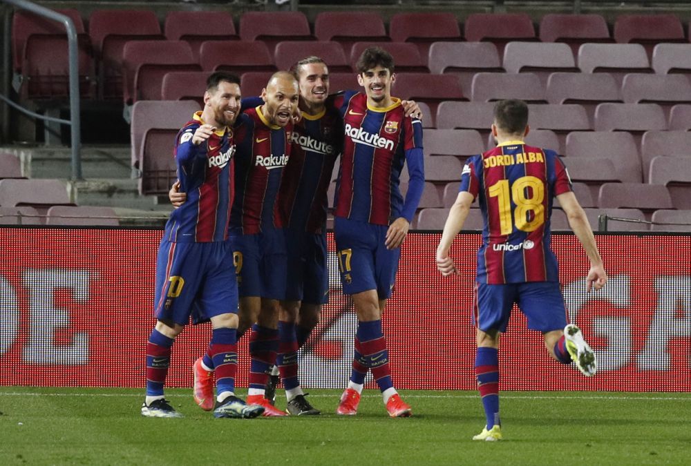 Barcelona's Martin Braithwaite celebrates scoring their third goal against Sevilla in the Copa Del Rey with teammates at Camp Nou, Barcelona March 3, 2021. u00e2u20acu201d Reuters pic