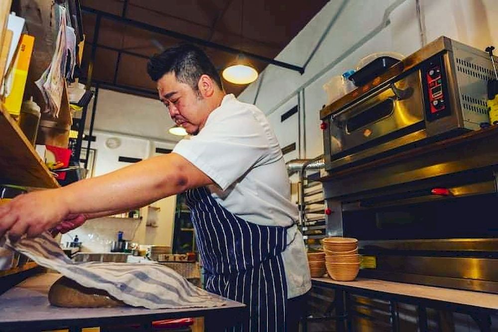 Artisan Handmade Bread’s Sam Lau bakes up wholemeal and rye sourdough breads in Ipoh — Photo courtesy of Artisan Handmade Bread’s Facebook page