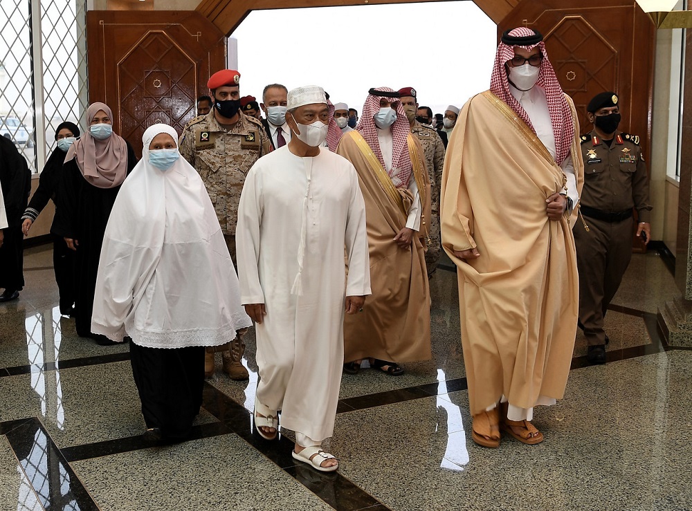Prime Minister Tan Sri Muhyiddin Yassin and his wife Puan Sri Noorainee Abdul Rahman (right) arrive at the Prince Mohammad bin Abdulaziz International Airport in Madinah March 7, 2021. u00e2u20acu201d Bernama pic