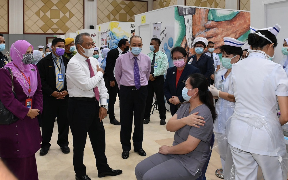 Prime Minister Tan Sri Muhyiddin Yassin (third left) during a visit to a Covid-19 vaccination centre in Kota Kinabalu March 22, 2021. u00e2u20acu201d Bernama pic