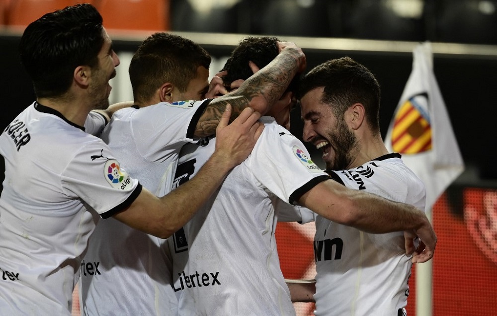 Valencia's Portuguese midfielder Goncalo Guedes (second right) celebrates with teammates after scoring a goal during the match againt Villarreal March 6, 2021. u00e2u20acu2022 AFP pic
