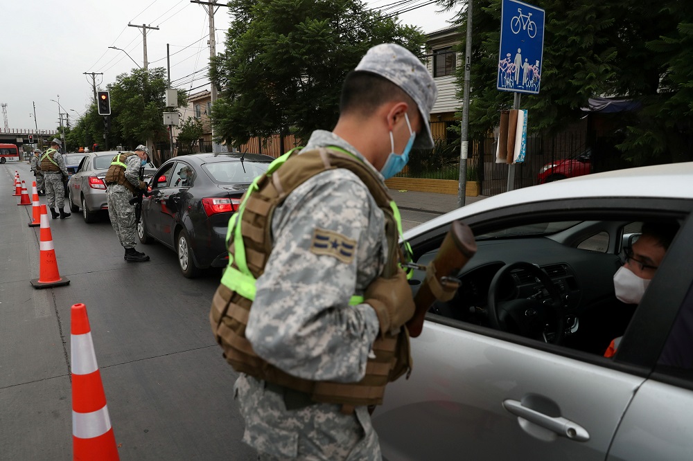Soldiers check safeguards at a check point, as local town halls have increased the lockdown restrictions during the Covid-19 outbreak, in Santiago, Chile March 18, 2021. u00e2u20acu2022 Reuters pic