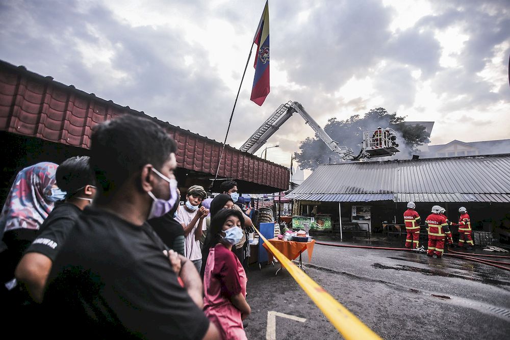 Fire destroyed more than 40 stalls at the Dato Keramat wet market along Jalan Keramat Dalam in Kuala Lumpur, March 17, 2021. — Picture by Hari Anggara