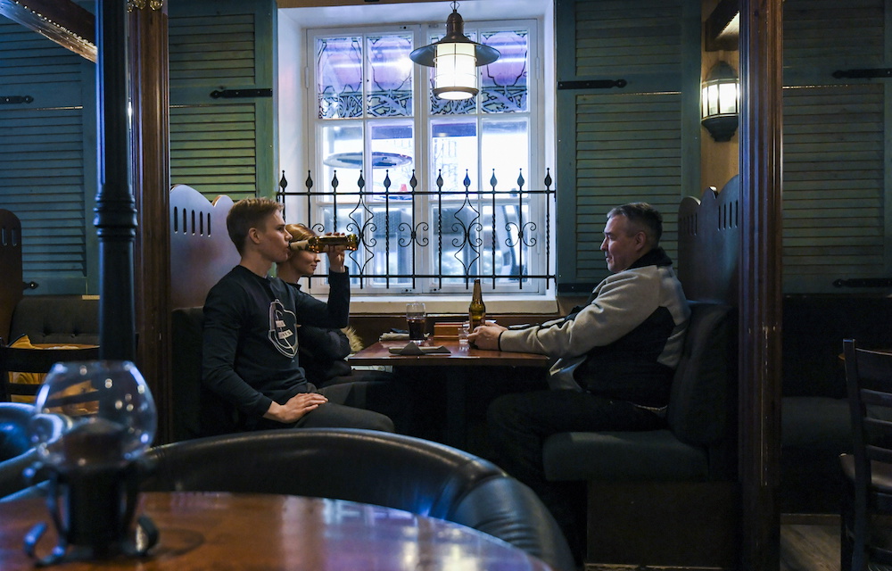 Clients enjoy their beers at the Czech-style pub-restaurant Vltava, amid a state of emergency due to coronavirus disease outbreak, in central Helsinki, Finland March 7, 2021. ― Reuters pic