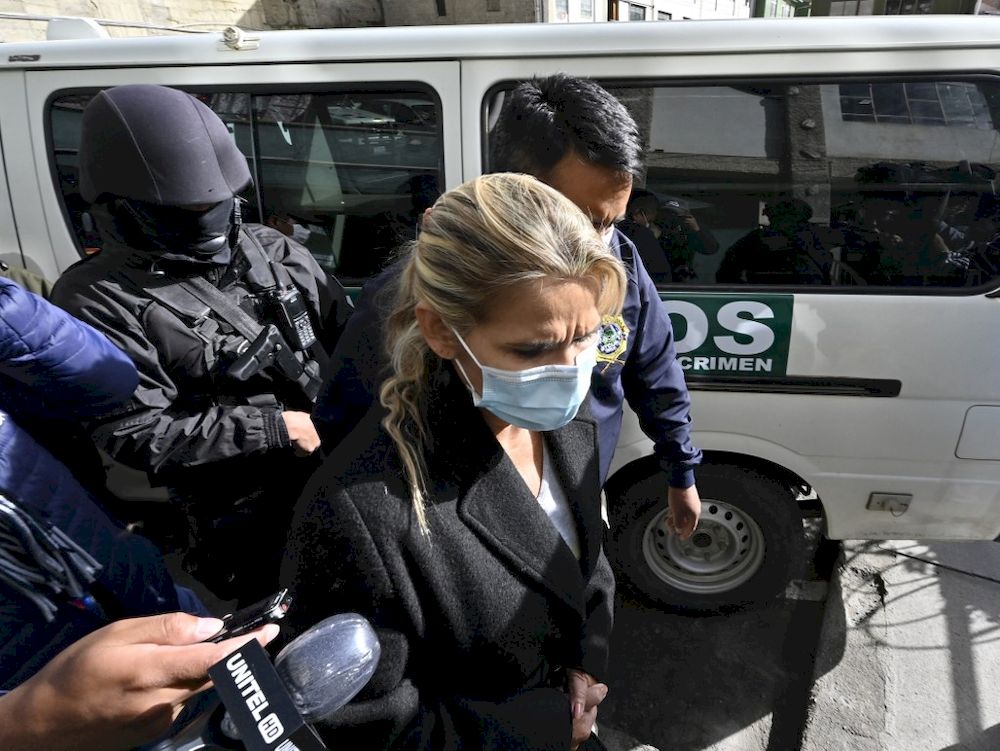 In this file photo taken on March 13, 2021, former interim Boliviau00e2u20acu2122s President Jeanine Anez (centre) is escorted by police members of the Special Force against Crime (FELCC) after being arrested in La Paz. u00e2u20acu201d AFP pic