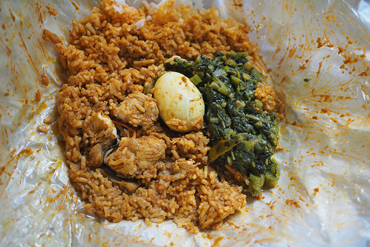 Restoran Tajuddin Hussain's 'nasi kandar' with fish and vegetables is more traditional with cleaner flavours.