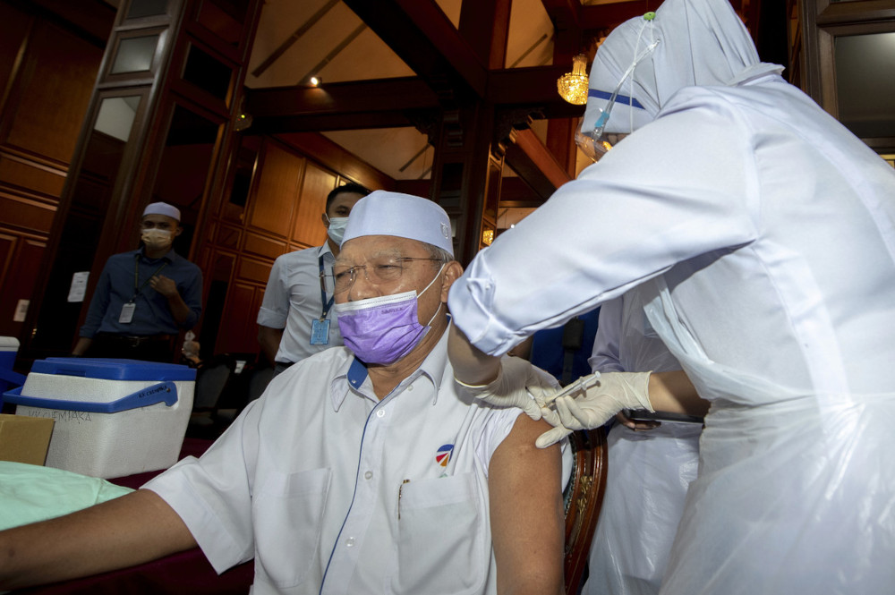 Kelantan Mentri Besar Datuk Ahmad Yakob receives the second dose of the Pfizer-BioNTech Covid-19 vaccine in Kota Baru, March 23, 2021. u00e2u20acu201d Bernama pic 