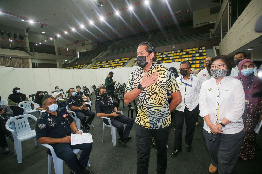 Minister of Science, Technology and Innovation Khairy Jamaluddin during a visit to the vaccination centre at the Indera Mulia Stadium in Ipoh March 16, 2021. u00e2u20acu201d Picture by Farhan Najib