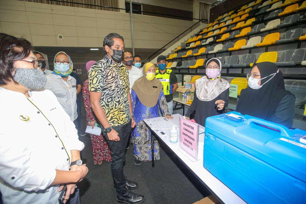 Minister of Science, Technology and Innovation Khairy Jamaluddin during a visit to the vaccination centre at the Indera Mulia Stadium in Ipoh March 16, 2021. u00e2u20acu201d Picture by Farhan Najib