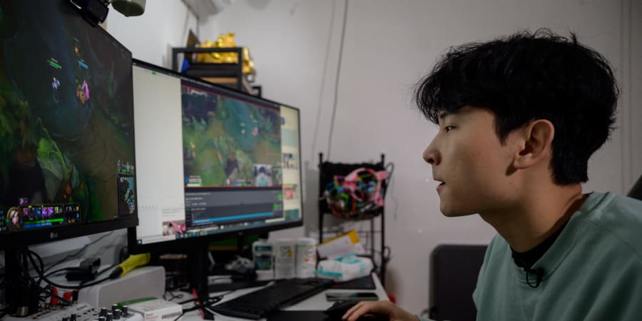 This photo taken on February 8, 2021 shows South Korean gamer Kim Min-kyo streaming computer games at his home near Anyang south of Seoul. u00e2u20acu201d ETX Studio picnn