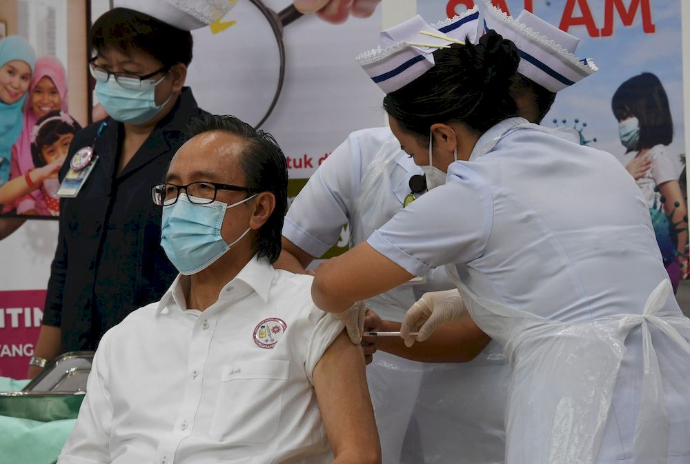 Sabah Local Government and Housing Minister Datuk Masidi Manjun receiving the Pfizer-BioNTech CoviD-19 vaccine injection in Kota Kinabalu, March 4, 2021. u00e2u20acu201d Bernama pic