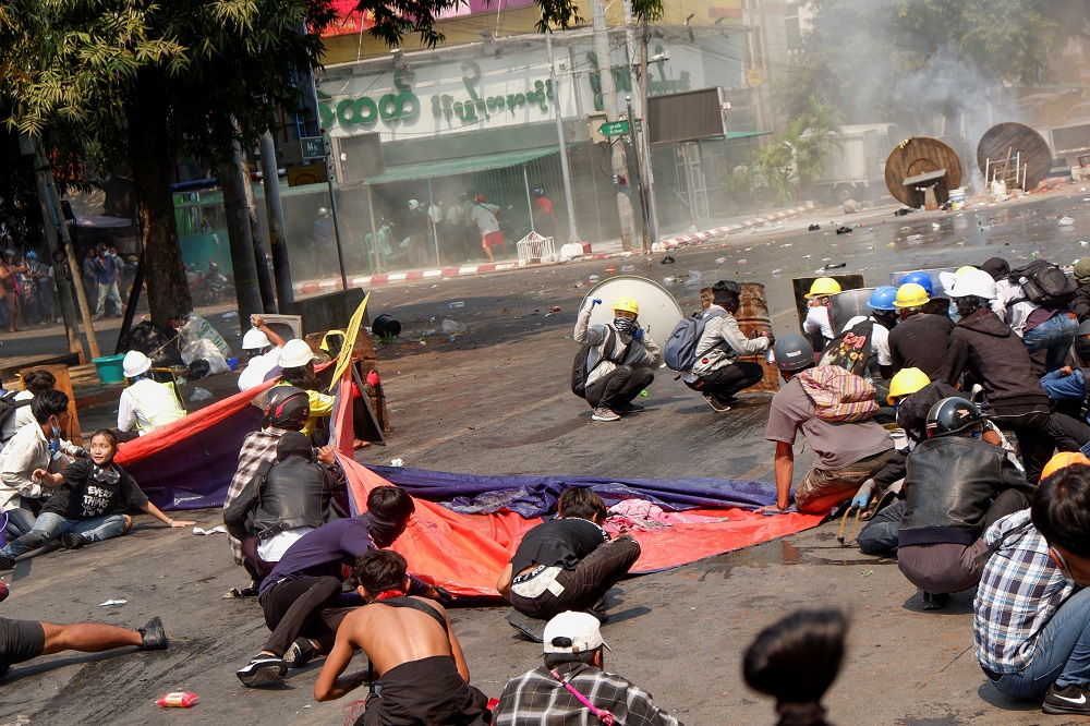 Protesters crouch after police opened fire to disperse an anti-coup protest in Mandalay, Myanmar, March 3, 2021. Among them, Angel, 19, left, also known as Kyal Sin, took cover before she was shot in the head. u00e2u20acu2022 Reuters pic