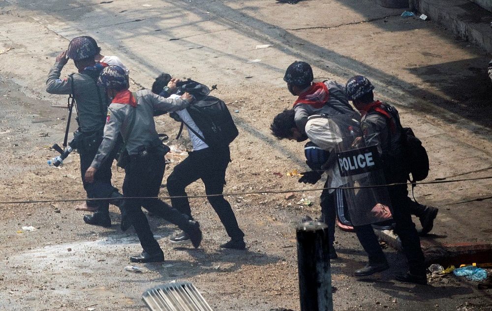 Riot police officers detain demonstrators during a protest against the military coup in Yangon, Myanmar March 2, 2021. u00e2u20acu2022 Reuters pic