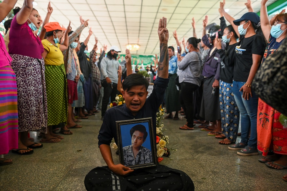 People flash a three-finger salute as they attend the funeral of victims shot dead during the anti-coup protest in Yangon, Myanmar March 5, 2021. u00e2u20acu2022 Reuters pic