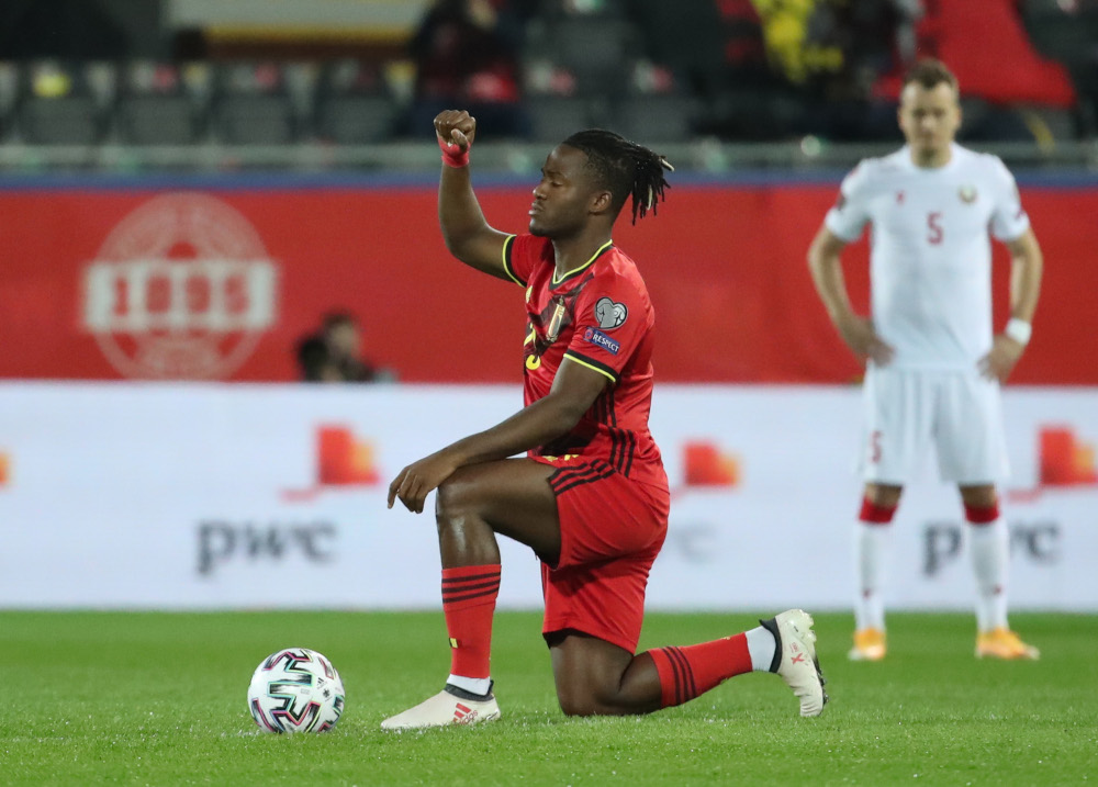 Belgiumu00e2u20acu2122s Michy Batshuayi kneels in support of the Black Lives Matter campaign before the World Cup Qualifiers Europe Group E match against Belarus at Den Dreef, Leuven, March 30, 2021. u00e2u20acu201d Reuters pic 