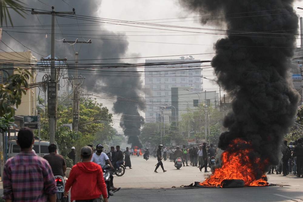 Tires burn on a street as protests against the military coup continue, in Mandalay, Myanmar March 27, 2021. — Reuters pic