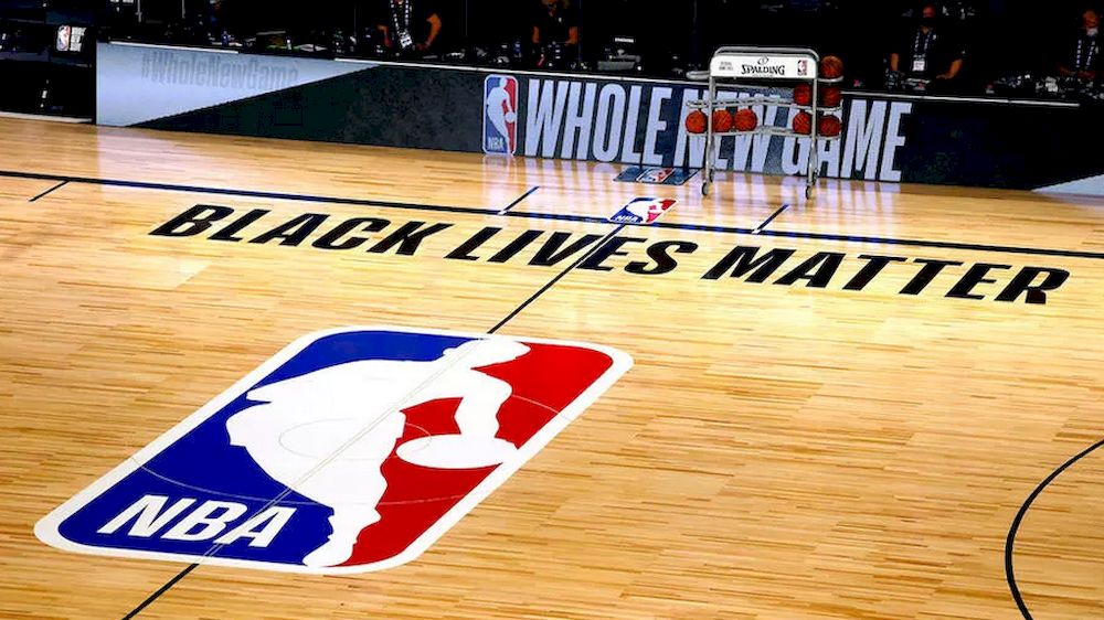 A basketball court shows the NBA logo and the slogan Black Lives Matter before the start of a game between the Denver Nuggets and the Miami Heat on August 1, 2020 in Lake Buena Vista, Florida, USA. u00e2u20acu201d AFP pic