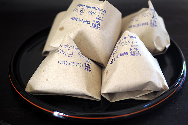 Wrapped in brown paper, the 'nasi lemak' is usually bought in big quantities for the whole family to enjoy