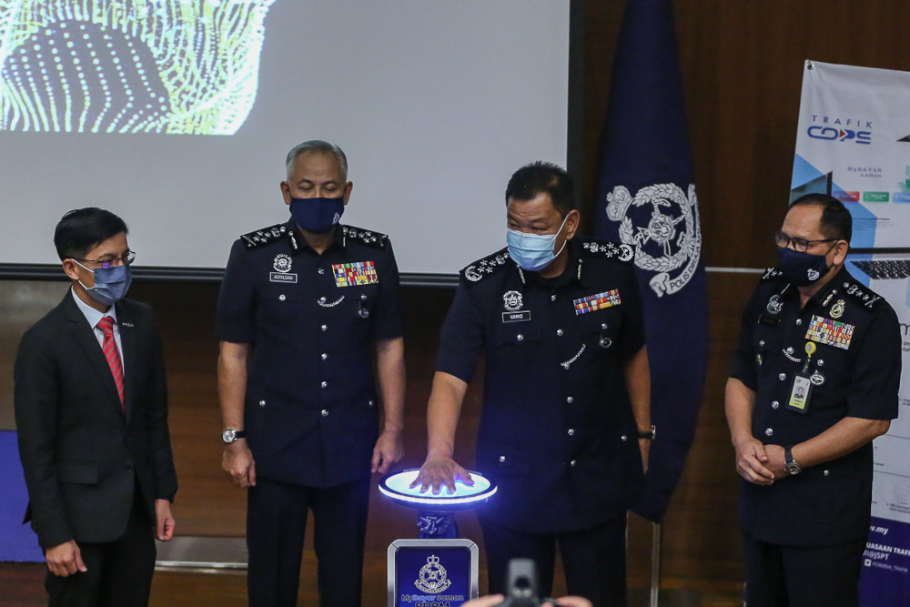 Inspector-General of Police Tan Sri Abdul Hamid Bador officiating the launch of MyBayar Saman app and online portal at the Bukit Aman headquarters in Kuala Lumpur March 25, 2021. u00e2u20acu201d Picture by Yusof Mat Isa