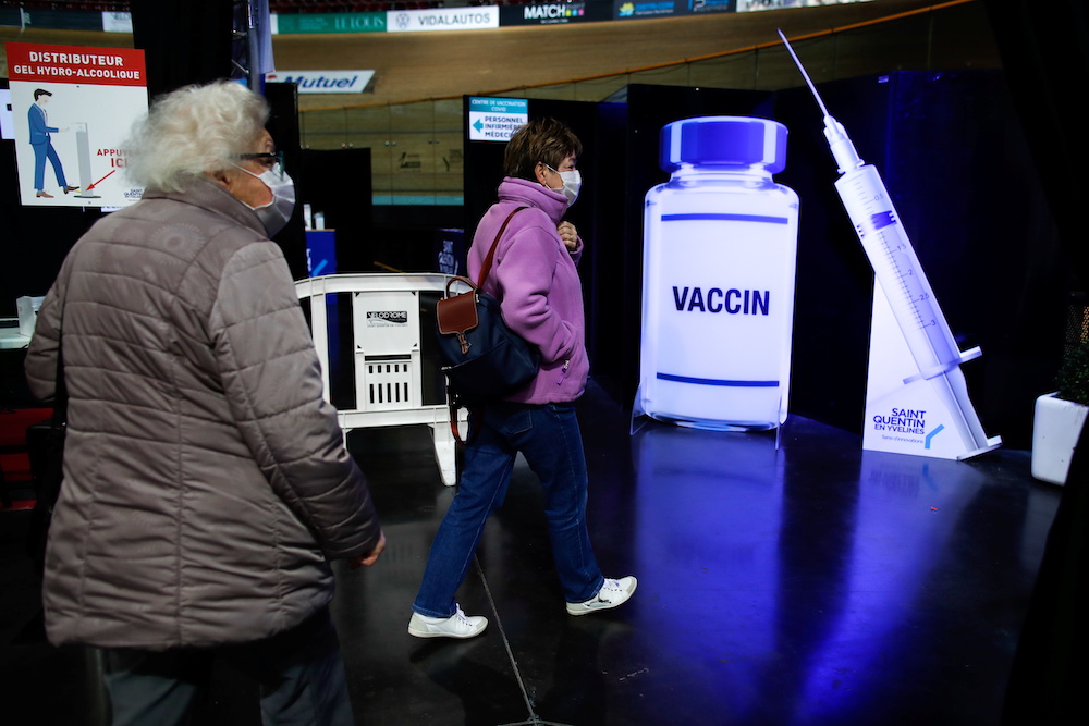 Women leave after getting a dose of the Pfizer-BioNTech Covid-19 vaccine as part of the coronavirus disease vaccination campaign southwest of Paris, France, March 26, 2021. u00e2u20acu201d Reuters pic