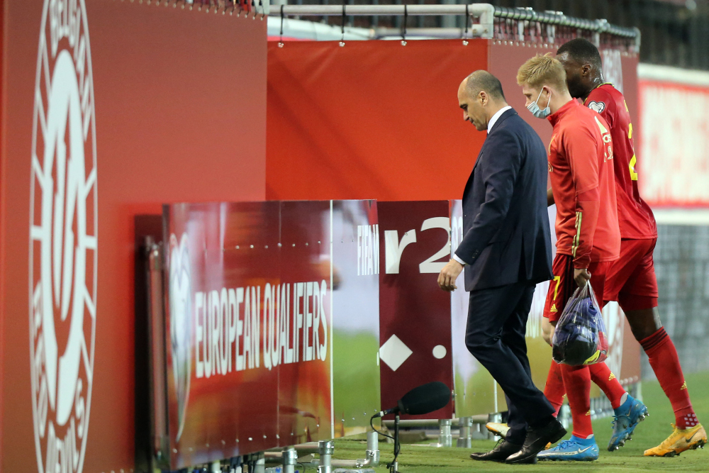 Coach Roberto Martinez and midfielder Kevin De Bruyne leave the pitch at the end of the Fifa World Cup Qatar 2022 qualification Group E football match against Belarus at the King Power at Den Dreef Stadium, in Heverlee, Leuven March 30, 2021. u00e2u20acu201d AFP pic 