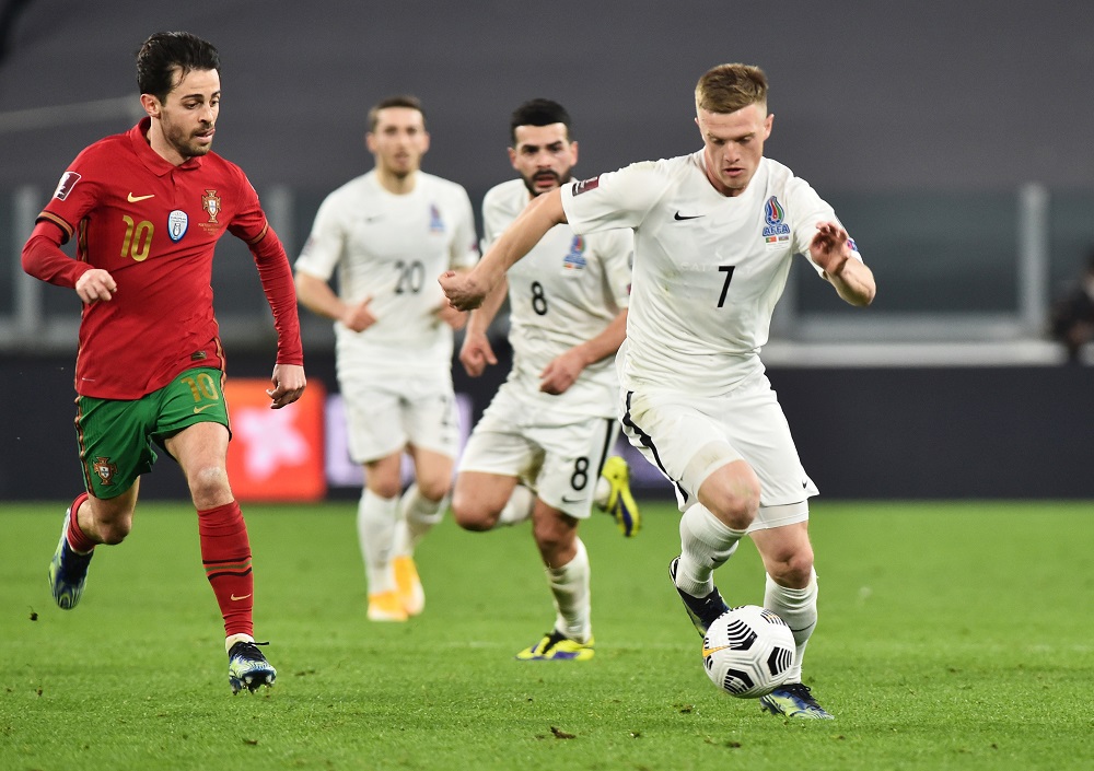 Portugal's Bernardo Silva in action with Azerbaijan's Anatolii Nuriev in Turin March 25, 2021. u00e2u20acu2022 Reuters pic