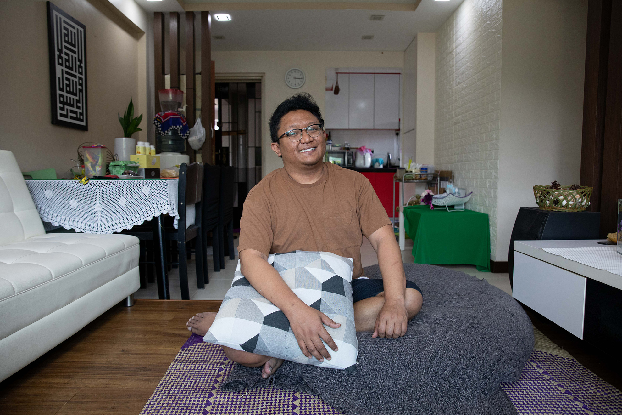 Mr Fadhil Azmi was renting for 10 years before he finally bought his own HDB flat in 2019 when he reached the minimum eligible age of 35 years old. — Photo b  Ili Nadhirah Mansor for TODAY