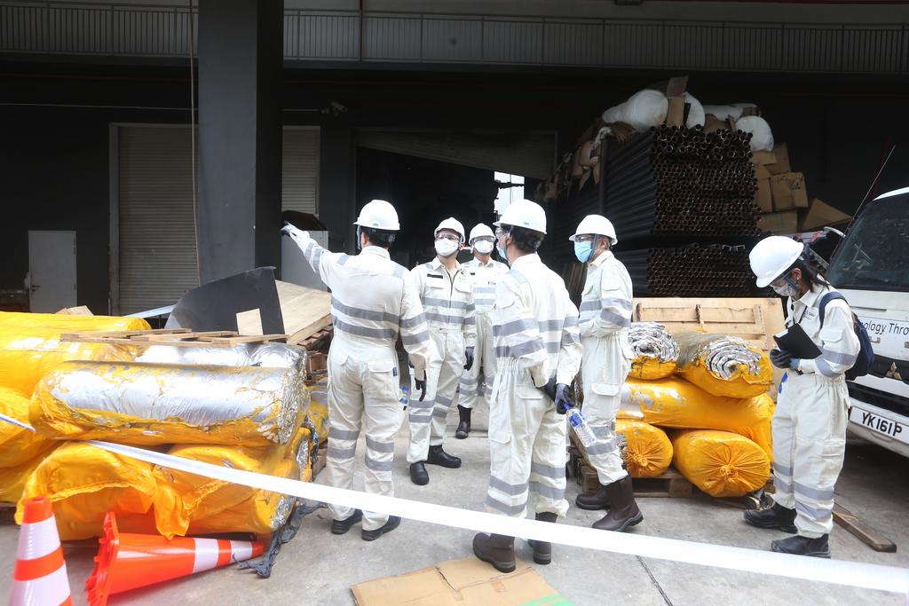 The inquiry committee into the fatal Tuas industrial explosion visits the site at 32E Tuas Avenue 11 on March 5, 2021 with Zaqy Mohamad, Senior Minister of State for Manpower. u00e2u20acu2022 TODAY pic