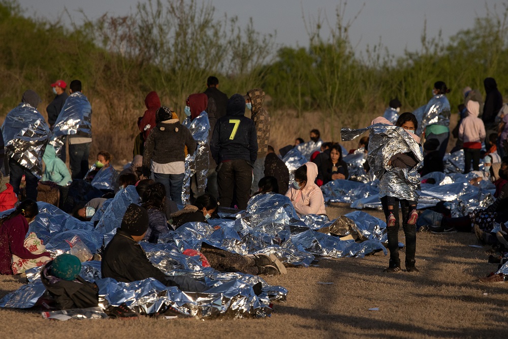 A group of asylum-seeking migrants from Central America take refuge near a baseball field after crossing the Rio Grande river into the United States from Mexico on rafts, in La Joya, Texas March 19, 2021. u00e2u20acu2022 Reuters pic