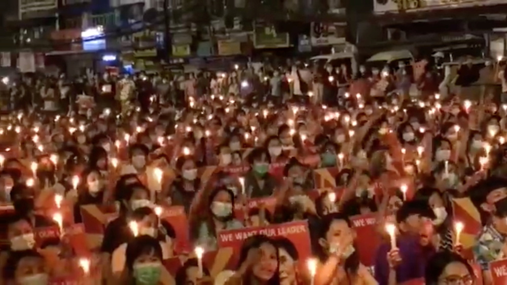 People take part in a candlelight gathering in Yangon, Myanmar, March 12, 2021, in this still image taken from video obtained by Reuters. Video taken March 12, 2021. u00e2u20acu201d Reuters picnn